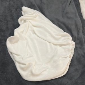 Cream one shoulder crop.